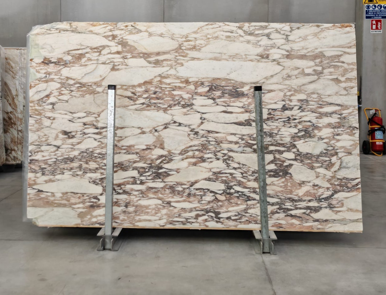 Calacatta Monet marble: artistic grey and blue veining on white background — inspired by Monet's water lilies